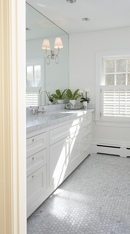 61 Sandy Pond Road Lincoln, MA 01773 - Photo 15 of 28 a spacious bathroom with a granite countertop sink and a mirror