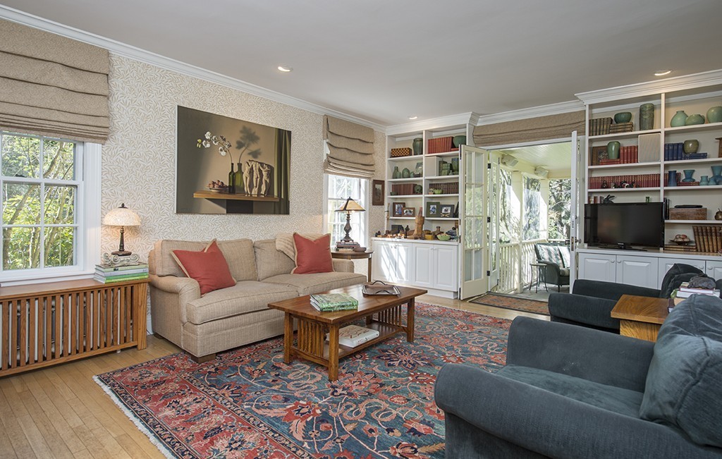 61 Sandy Pond Road Lincoln, MA 01773 - Photo 21 of 28 a living room with furniture and a flat screen tv