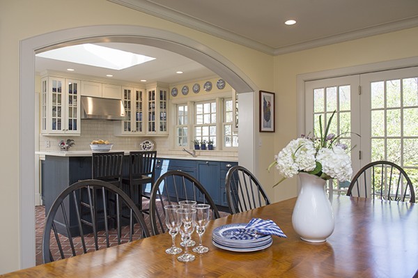 61 Sandy Pond Road Lincoln, MA 01773 - Photo 5 of 28 a dining room with furniture potted plants and wooden floor