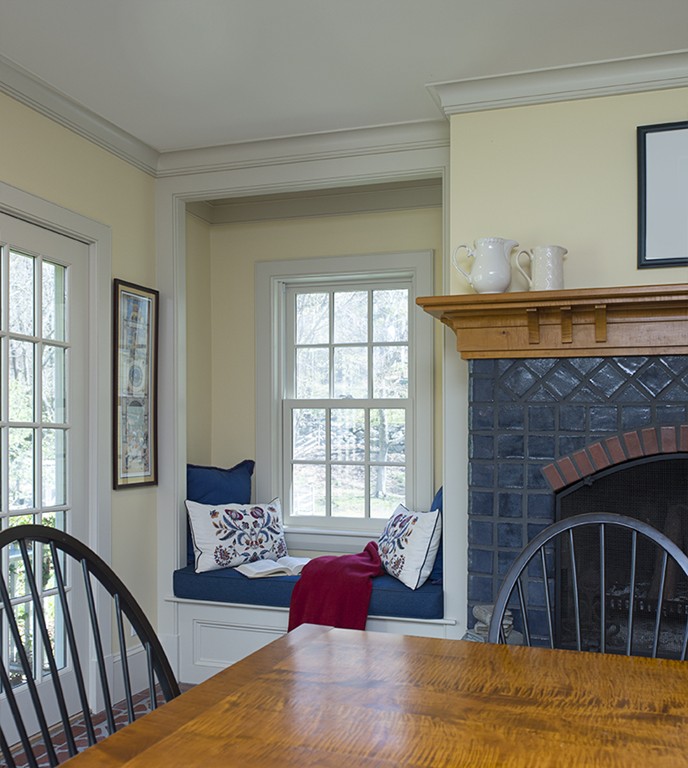61 Sandy Pond Road Lincoln, MA 01773 - Photo 9 of 28 a bedroom with a bed a fireplace and windows
