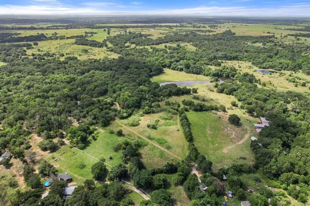 a backyard of a house with lots of green space