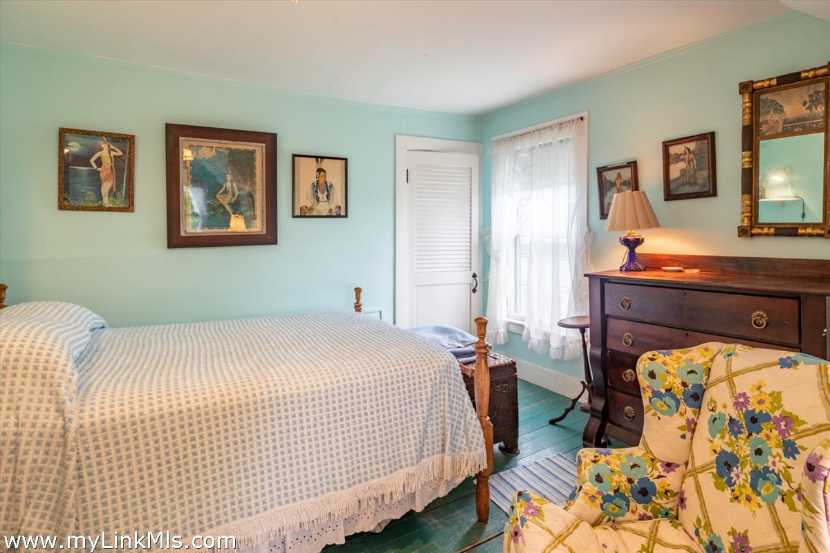 13 Cliff Road Nantucket, MA 02554 - Photo 29 of 38 a bedroom with a bed and a dresser