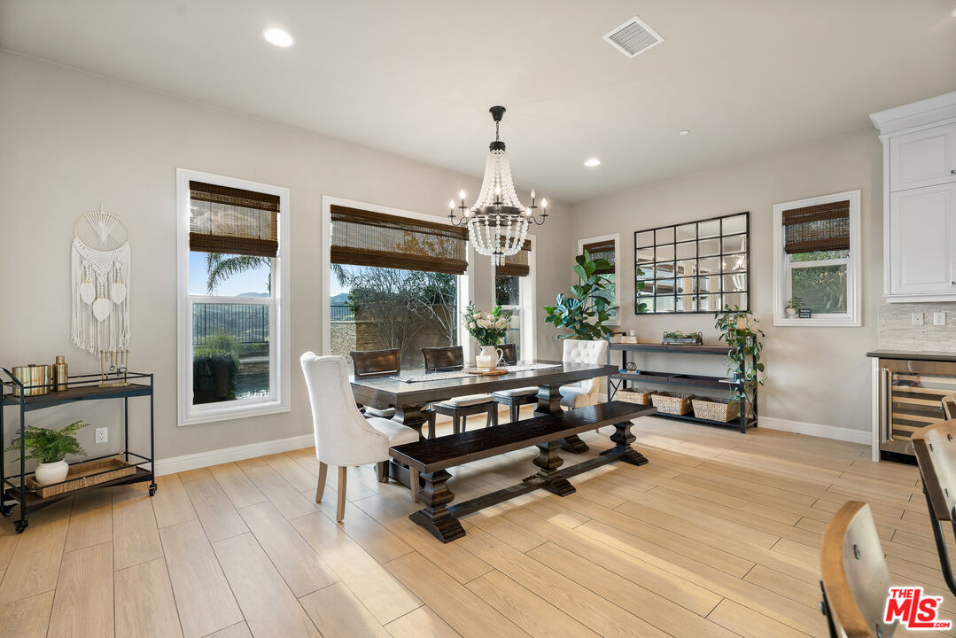12015 North Ricasoli Way Porter Ranch, CA 91326 - Photo 20 of 68 a living room with furniture a window and wooden floor