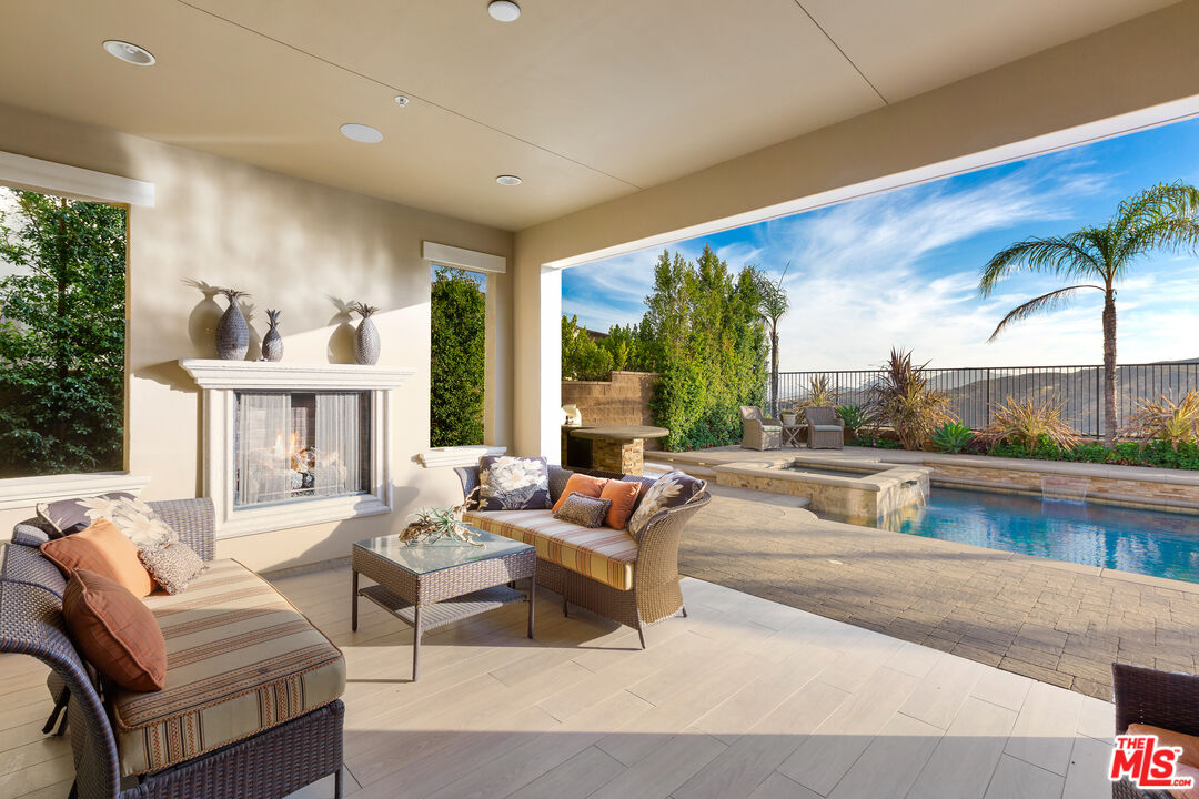 12015 North Ricasoli Way Porter Ranch, CA 91326 - Photo 24 of 68 a living room with furniture and a large window