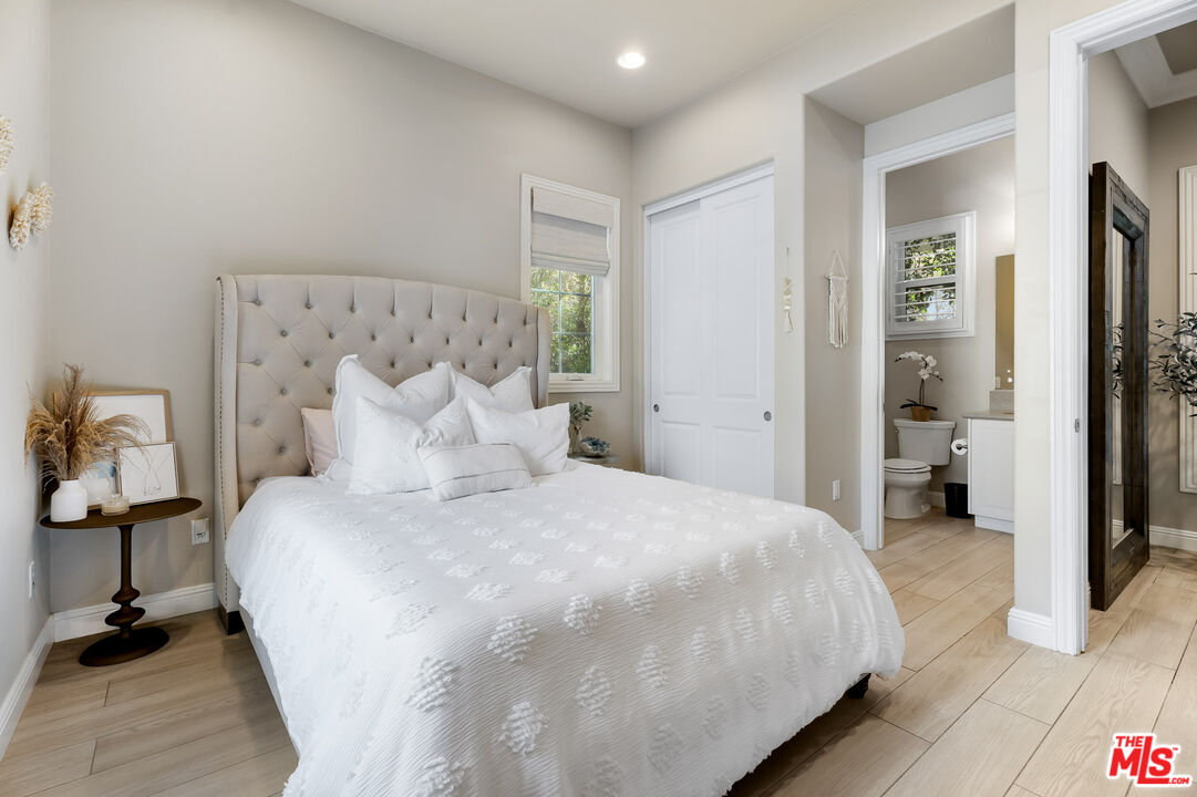 12015 North Ricasoli Way Porter Ranch, CA 91326 - Photo 29 of 68 a bedroom with a bed and a view of bathroom