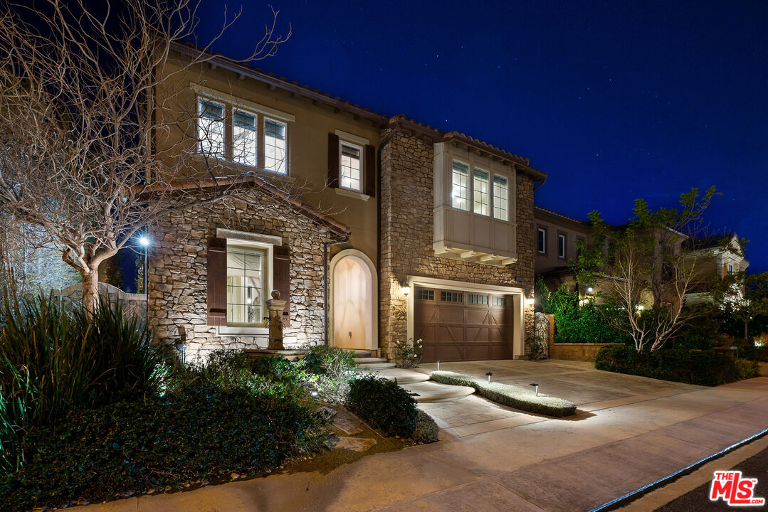 12015 North Ricasoli Way Porter Ranch, CA 91326 - Photo 4 of 68 a front view of a house