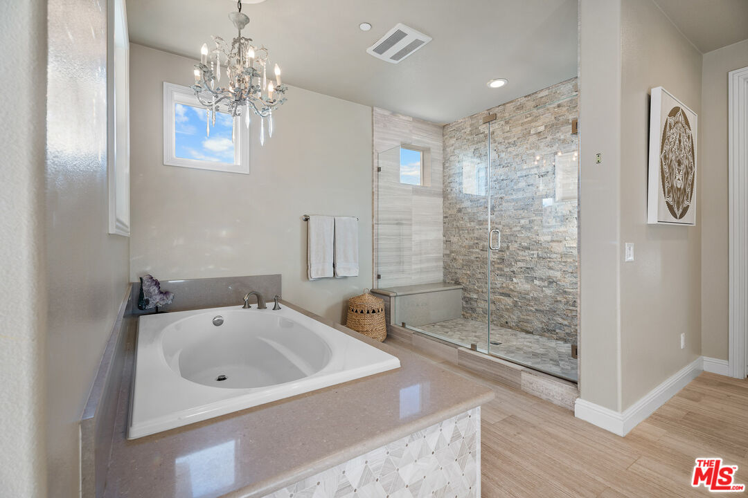 12015 North Ricasoli Way Porter Ranch, CA 91326 - Photo 44 of 68 a bathroom with a shower sink and mirror