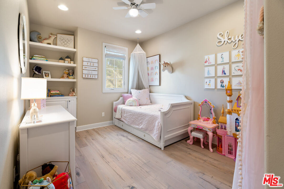 12015 North Ricasoli Way Porter Ranch, CA 91326 - Photo 60 of 68 a bedroom with a bed and a window