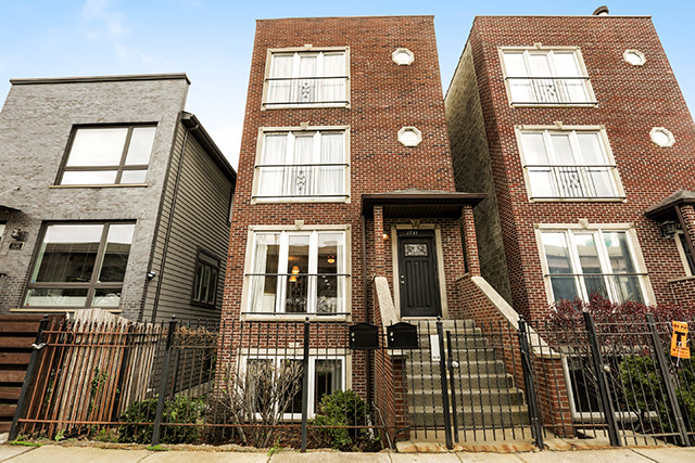 1731 South Ruble Street, Unit 1 Chicago, IL 60616 - Photo 2 of 25 front view of a brick house with a door