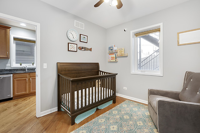 1731 South Ruble Street, Unit 1 Chicago, IL 60616 - Photo 12 of 25 a bedroom with furniture and windows