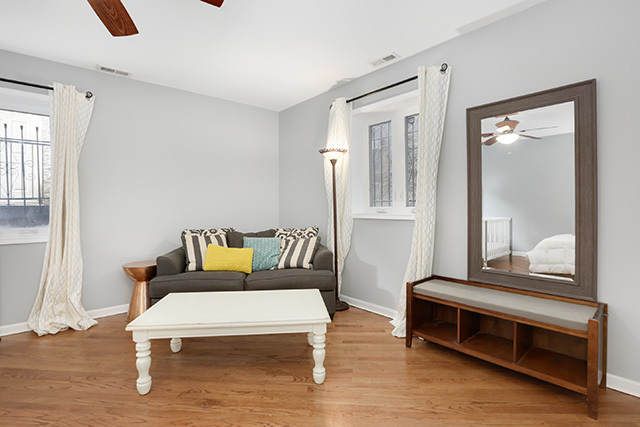 1731 South Ruble Street, Unit 1 Chicago, IL 60616 - Photo 16 of 25 a living room with furniture and a window