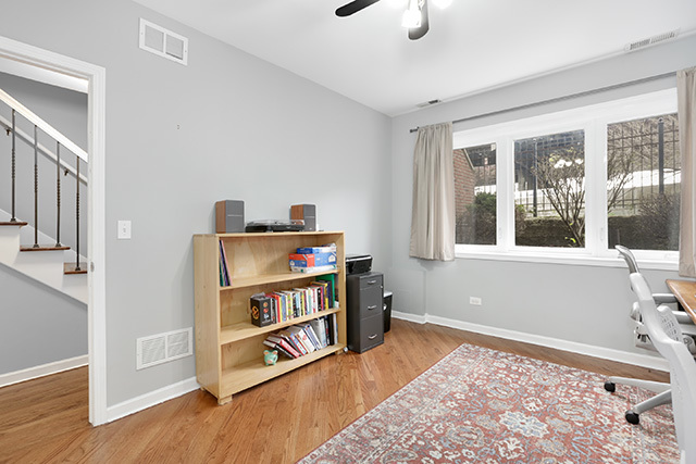 1731 South Ruble Street, Unit 1 Chicago, IL 60616 - Photo 21 of 25 a living room with furniture and a book shelf