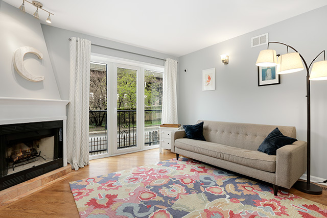 1731 South Ruble Street, Unit 1 Chicago, IL 60616 - Photo 4 of 25 a living room with furniture and a fireplace