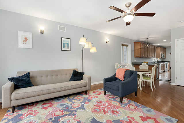1731 South Ruble Street, Unit 1 Chicago, IL 60616 - Photo 6 of 25 a living room with furniture and a wooden floor