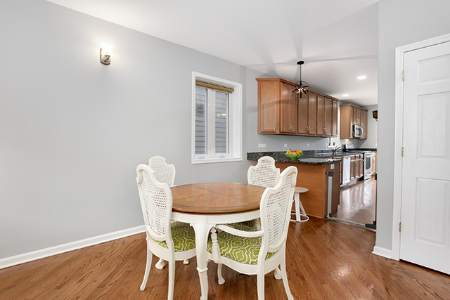 1731 South Ruble Street, Unit 1 Chicago, IL 60616 - Photo 8 of 25 a view of a dining room with furniture and wooden floor