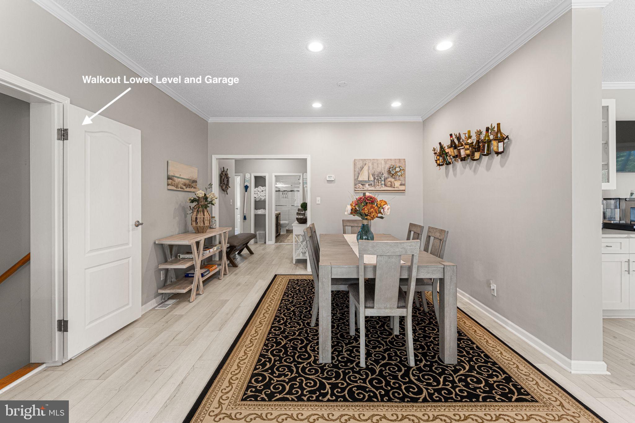 249 Spring Hill Road Lancaster, VA 22503 - Photo 18 of 65 a dining room with furniture and a rug