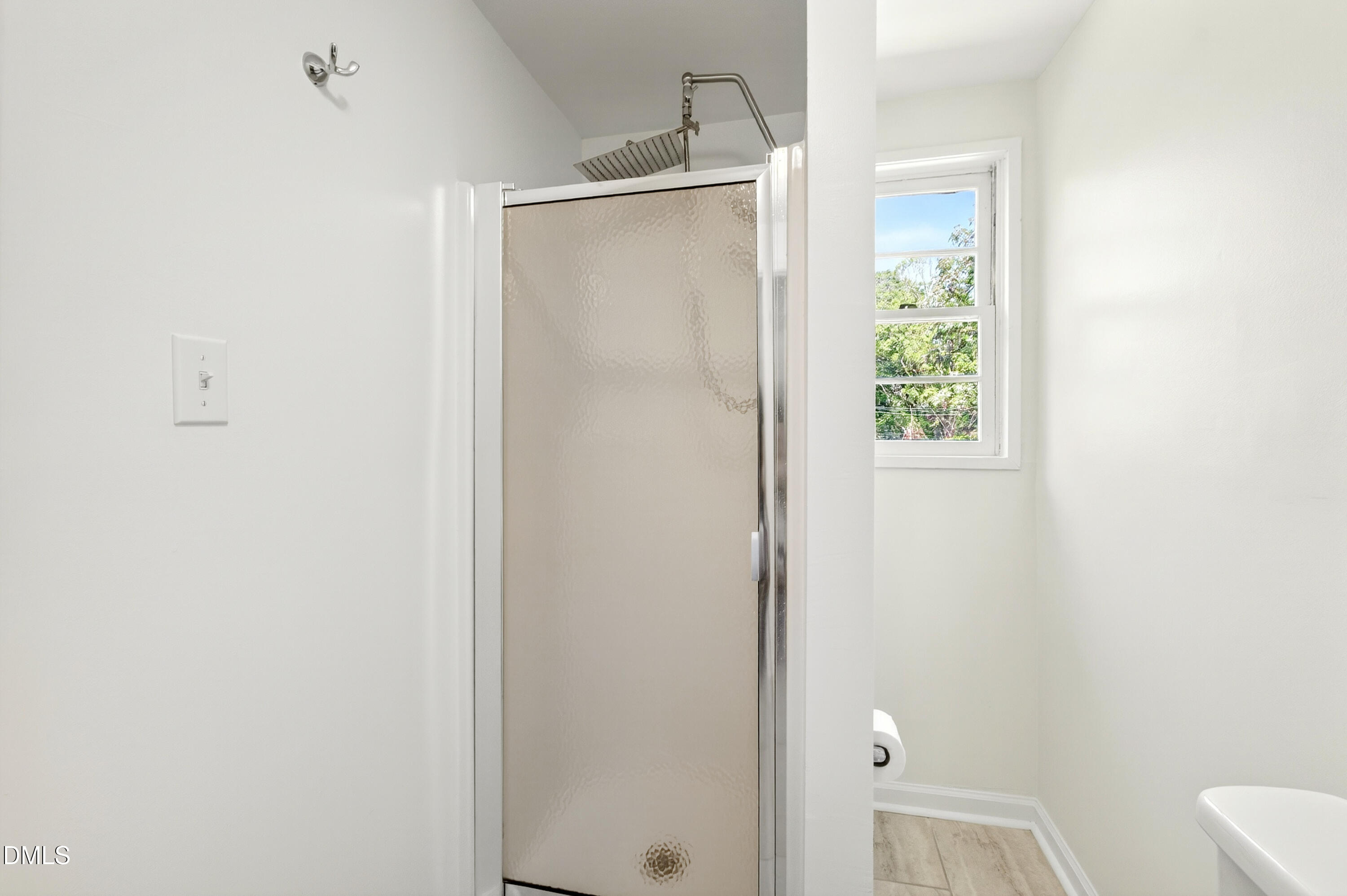 913 Washington Street Durham, NC 27701 - Photo 18 of 37 a bathroom with a glass shower door