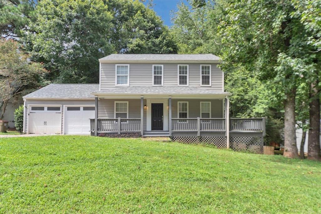 front view of a house with a yard