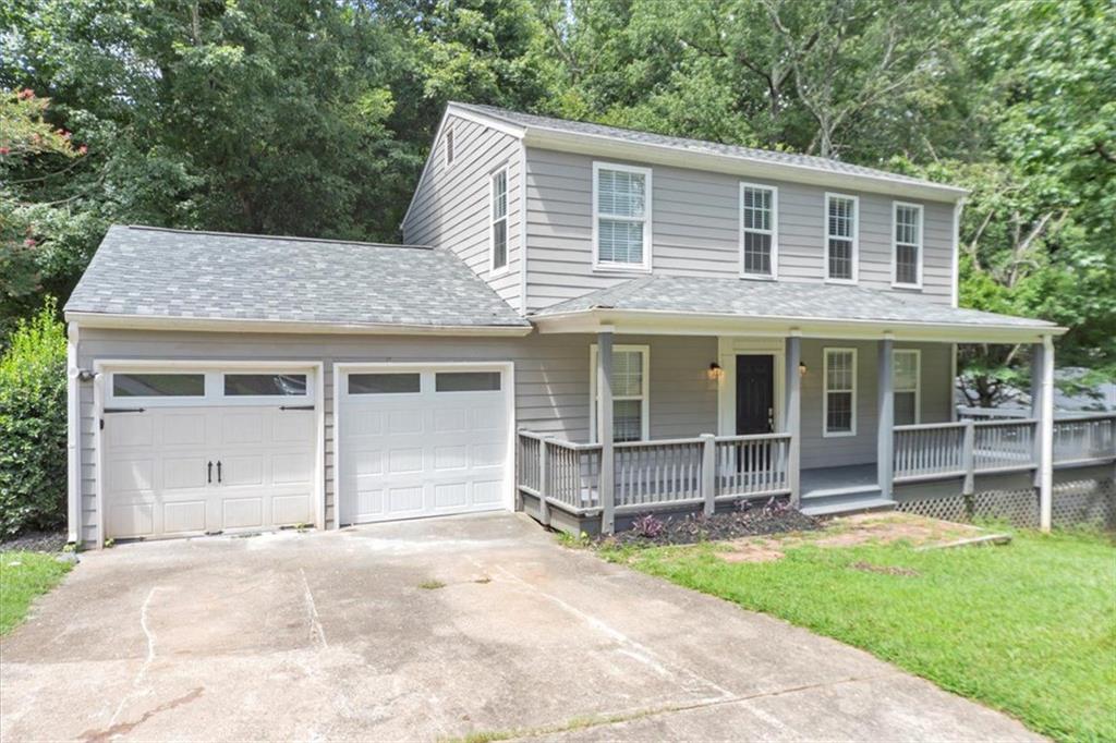 710 Country Manor Way Alpharetta, GA 30022 - Photo 2 of 33 a view of a house with a yard and large tree