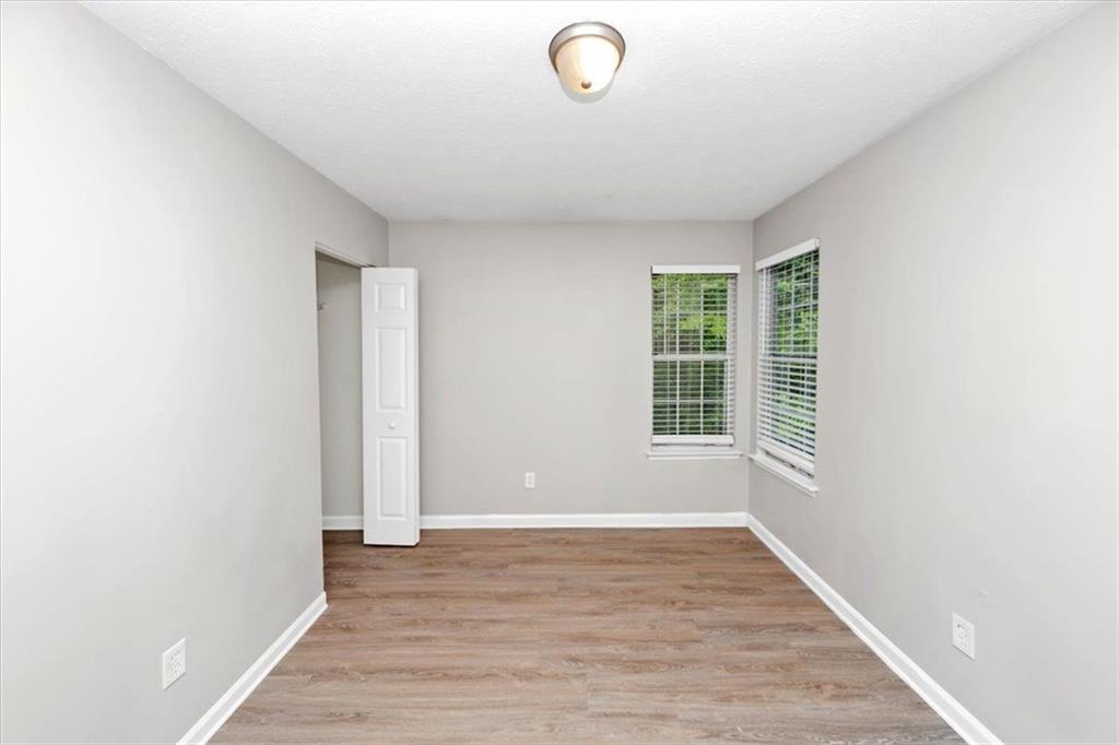 710 Country Manor Way Alpharetta, GA 30022 - Photo 25 of 33 a view of livingroom with hardwood floor and window