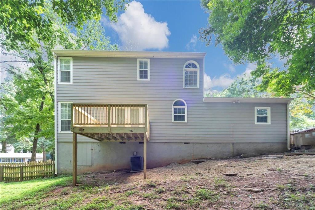 710 Country Manor Way Alpharetta, GA 30022 - Photo 31 of 33 a front view of a house with a yard