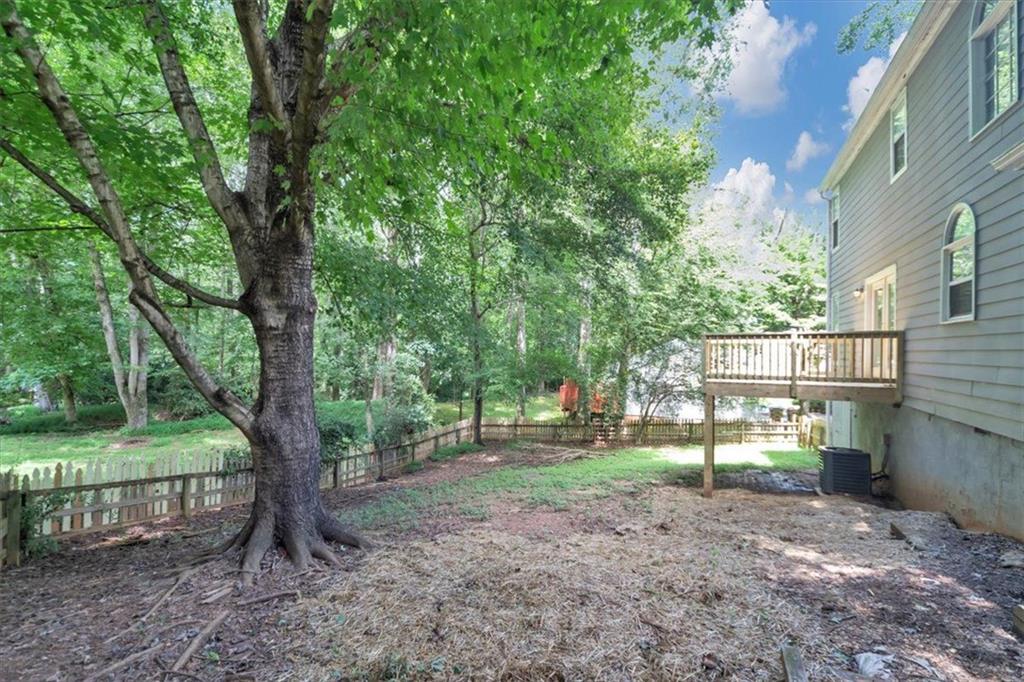 710 Country Manor Way Alpharetta, GA 30022 - Photo 32 of 33 a view of a yard with a tree