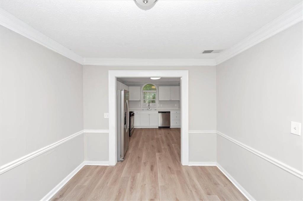 710 Country Manor Way Alpharetta, GA 30022 - Photo 10 of 33 a view of a hallway with wooden floor and a bathroom