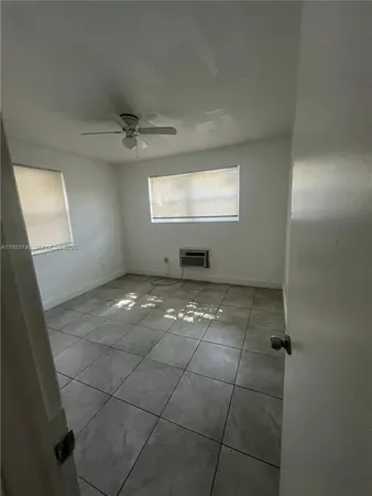 a view of a livingroom and window