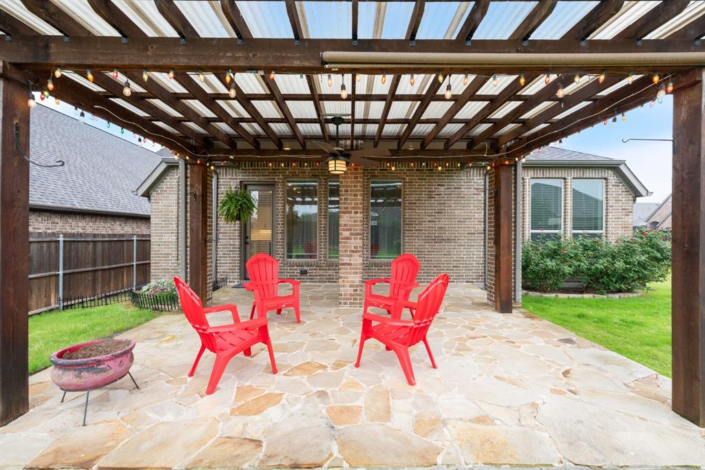 1501 Calcot Lane Forney, TX 75126 - Photo 3 of 34 Covered patio featuring an expansive flagstone surface.