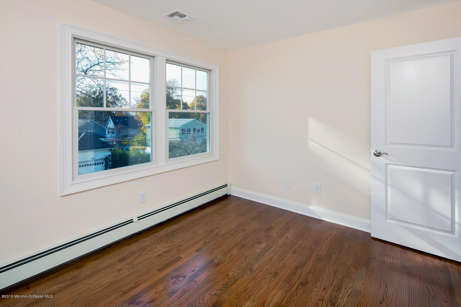 335 Spring Street Little Silver, NJ 07739 - Photo 22 of 46 an empty room with wooden floor and windows