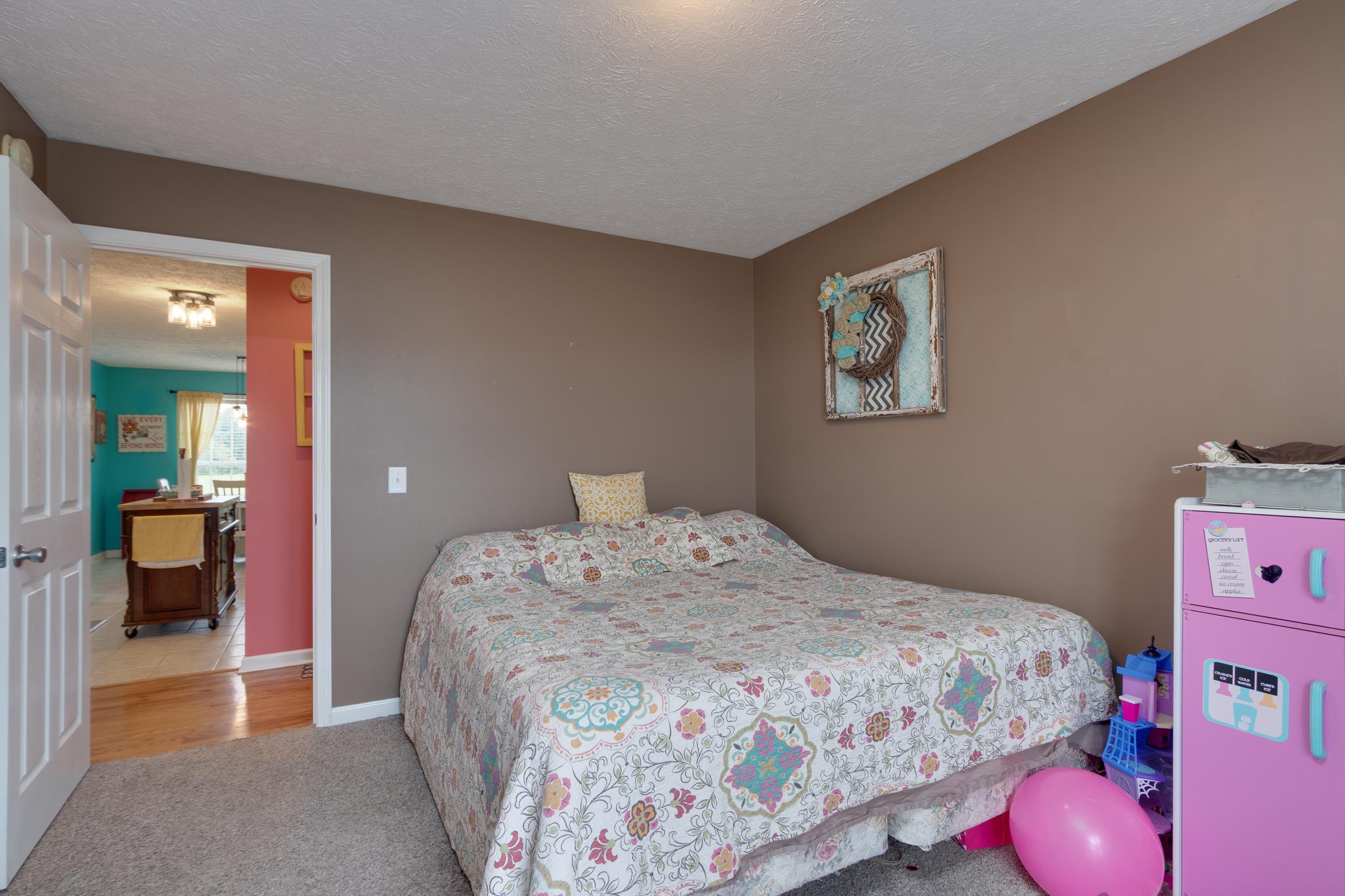 2109 Carthage Road Red Boiling Springs, TN 37150 - Photo 14 of 28 a bedroom with a bed and wooden floor