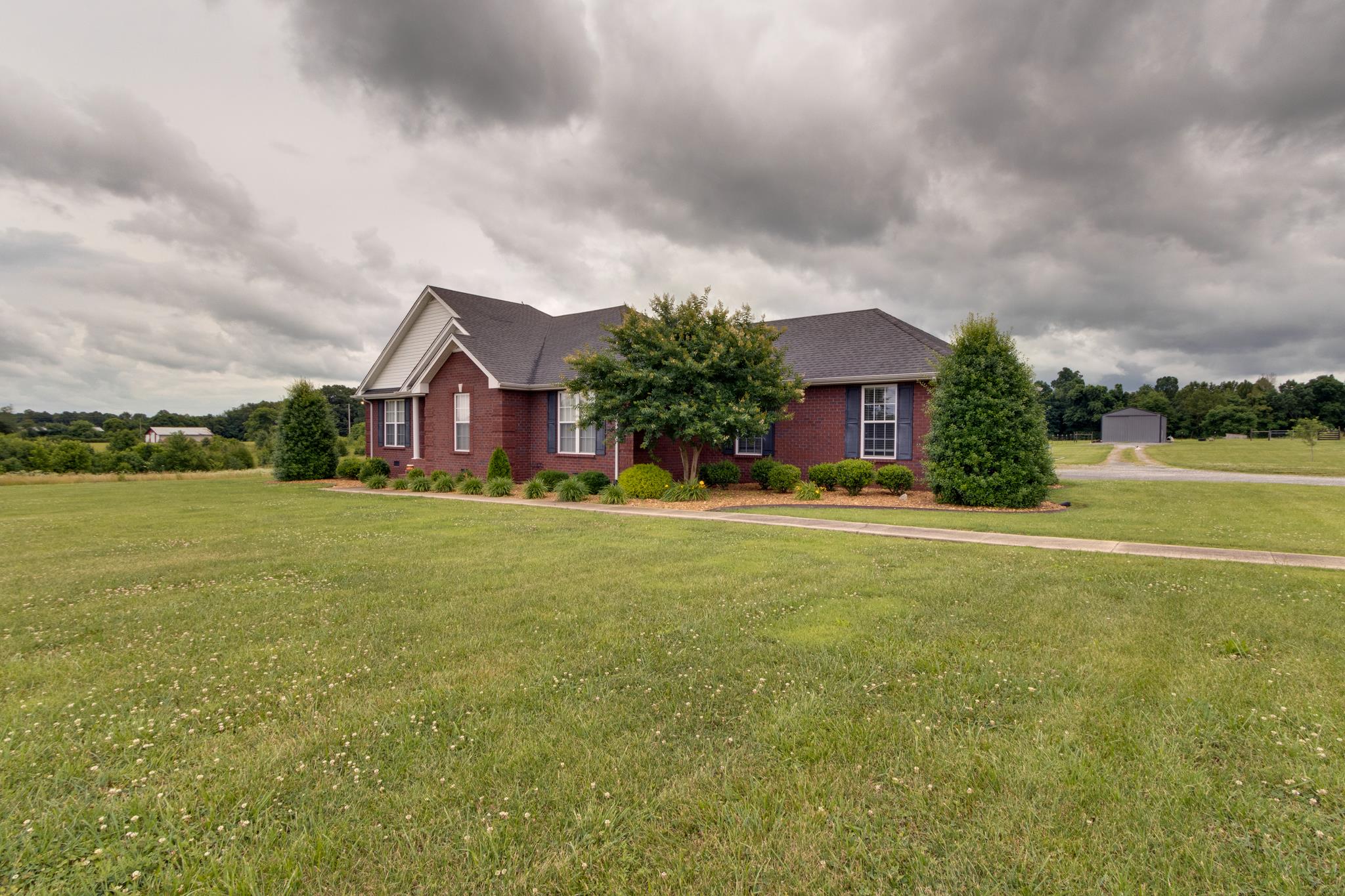 2109 Carthage Road Red Boiling Springs, TN 37150 - Photo 3 of 28 a front view of house with yard and green space