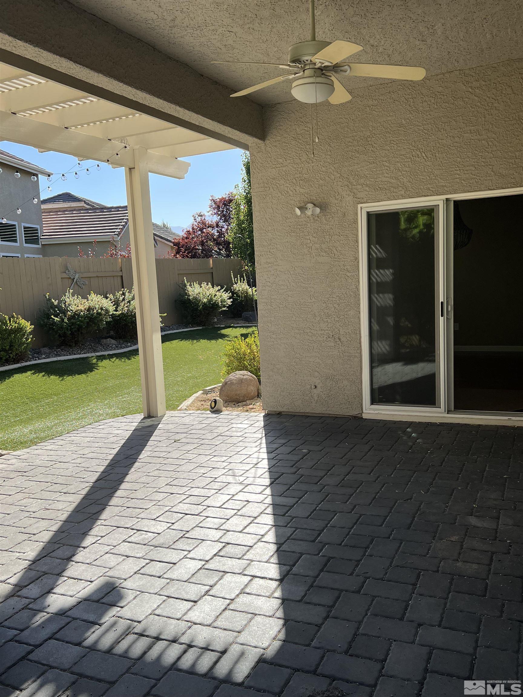 10600 Silver Cliff Way Reno, NV 89521 - Photo 19 of 24 a view of a porch with a floor to ceiling window and an outdoor space