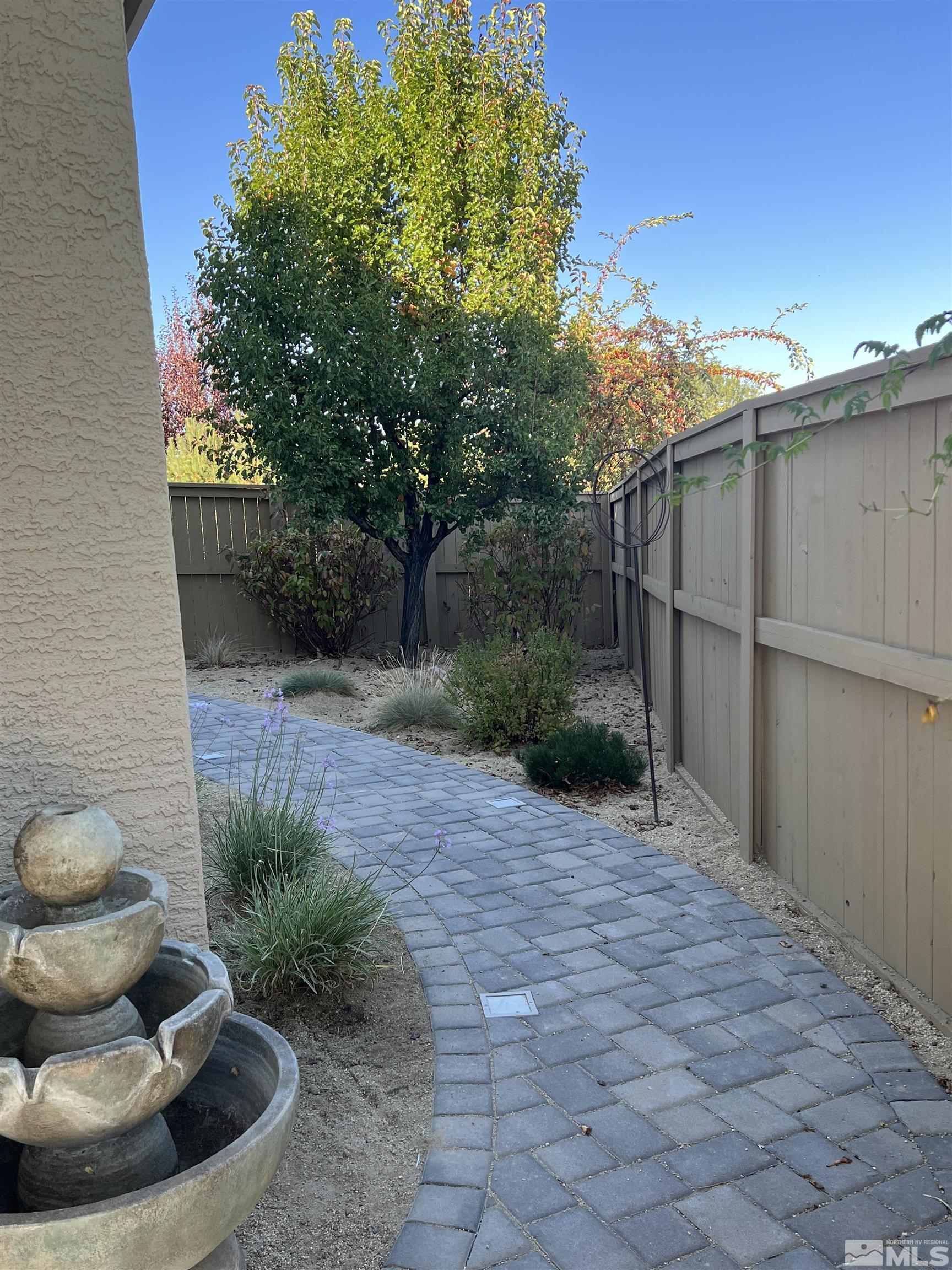 10600 Silver Cliff Way Reno, NV 89521 - Photo 20 of 24 a view of a backyard with plants and trees
