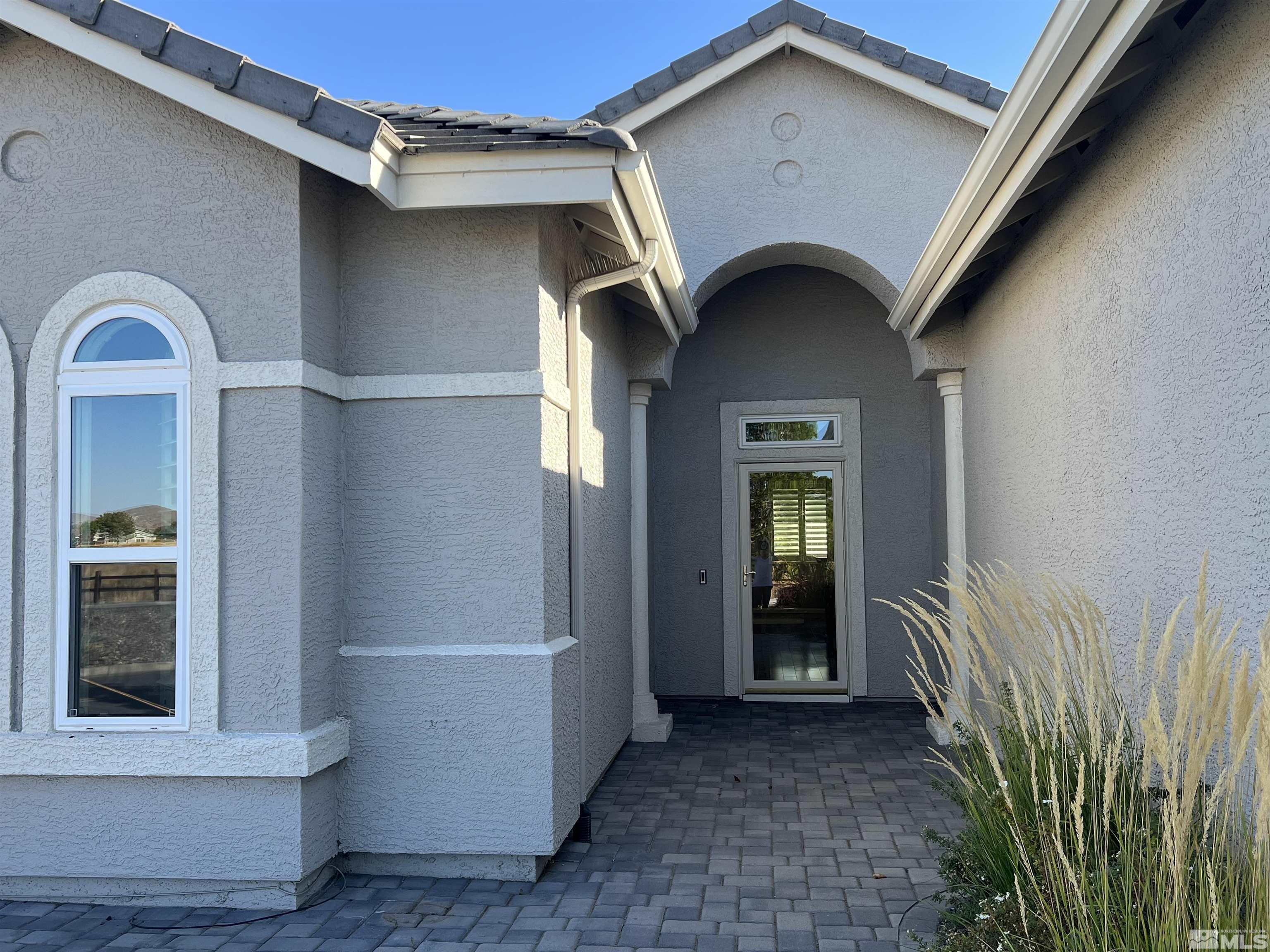 10600 Silver Cliff Way Reno, NV 89521 - Photo 2 of 24 a view of a car garage door