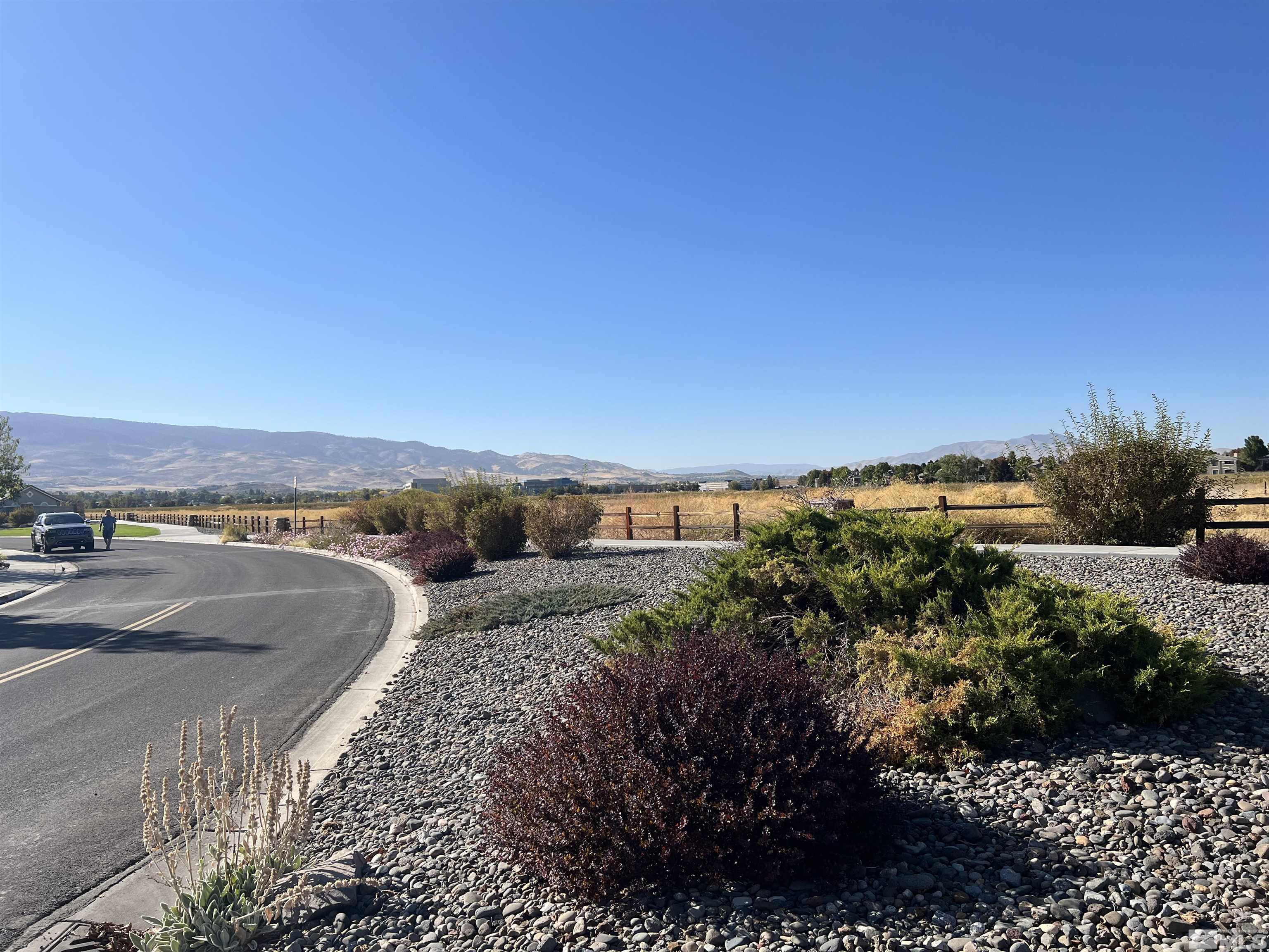 10600 Silver Cliff Way Reno, NV 89521 - Photo 23 of 24 a view of a dry yard with wooden fence