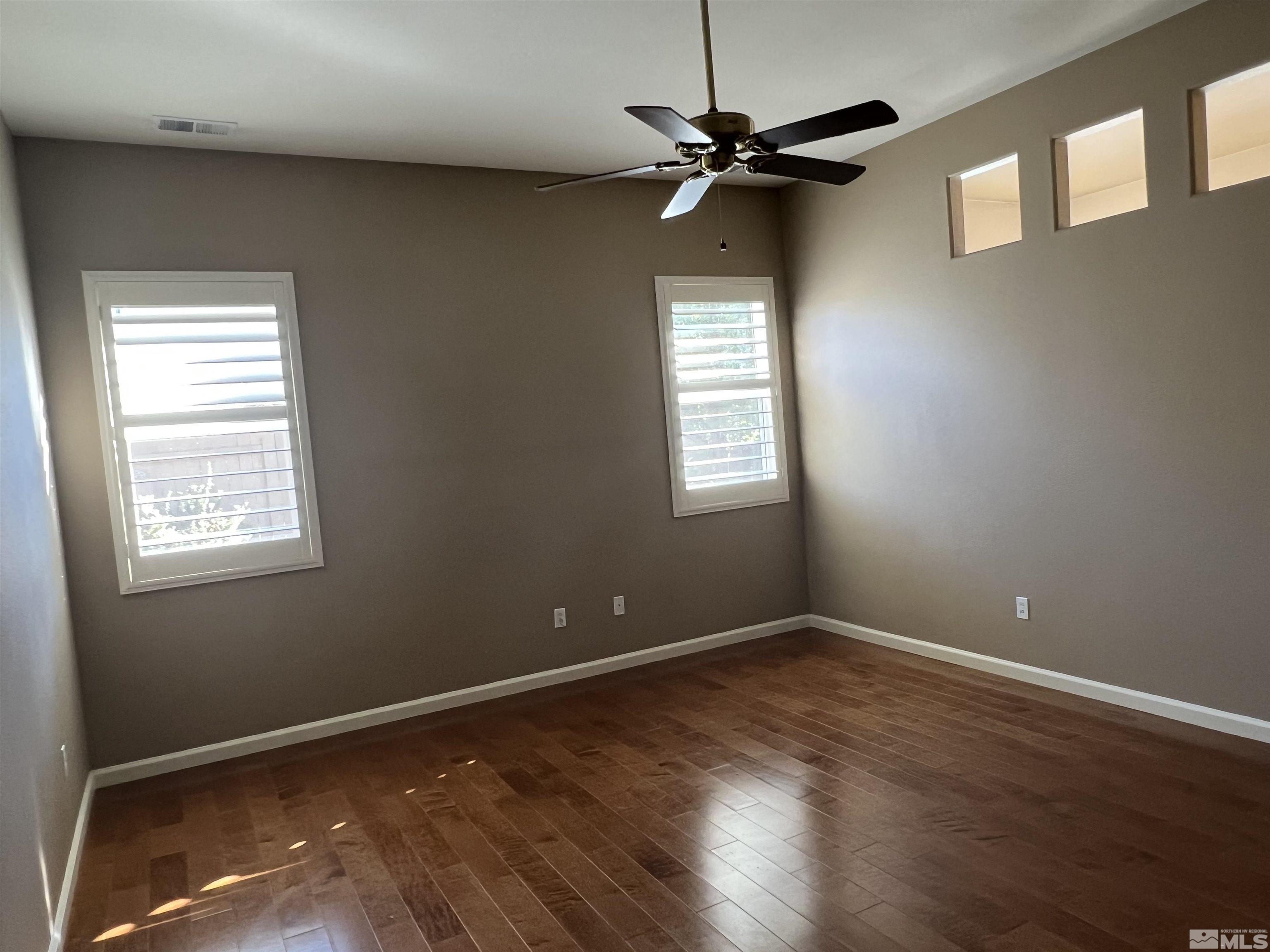 10600 Silver Cliff Way Reno, NV 89521 - Photo 10 of 24 a view of room with a ceiling fan and window