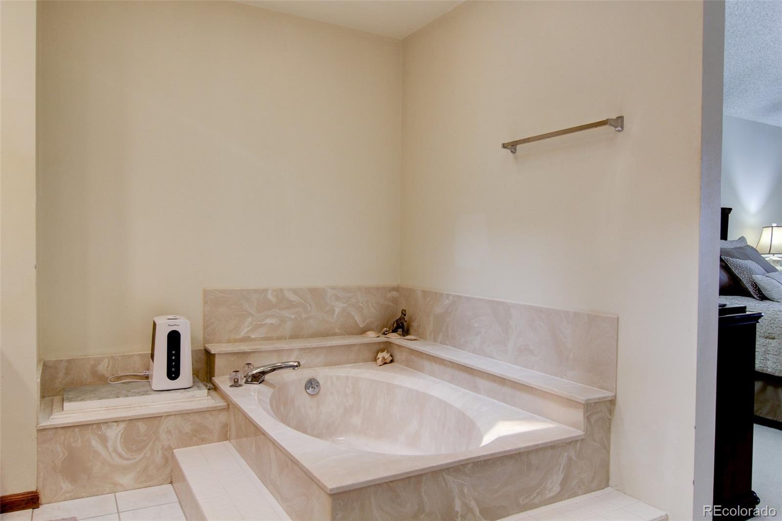 8096 Sweet Water Road Lone Tree, CO 80124 - Photo 15 of 25 a bathroom with a bathtub