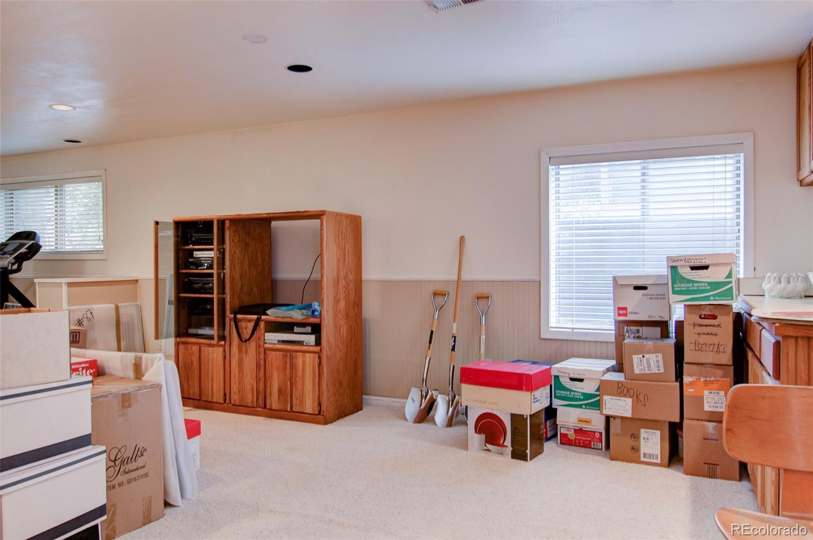 8096 Sweet Water Road Lone Tree, CO 80124 - Photo 21 of 25 a living room with furniture and flat screen tv