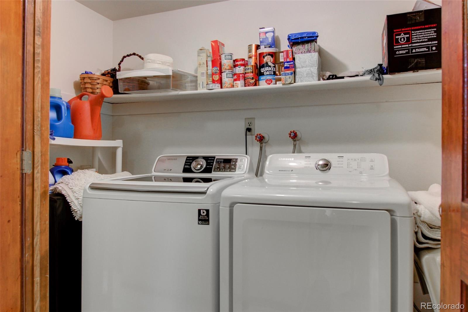 8096 Sweet Water Road Lone Tree, CO 80124 - Photo 22 of 25 a utility room with dryer and washer