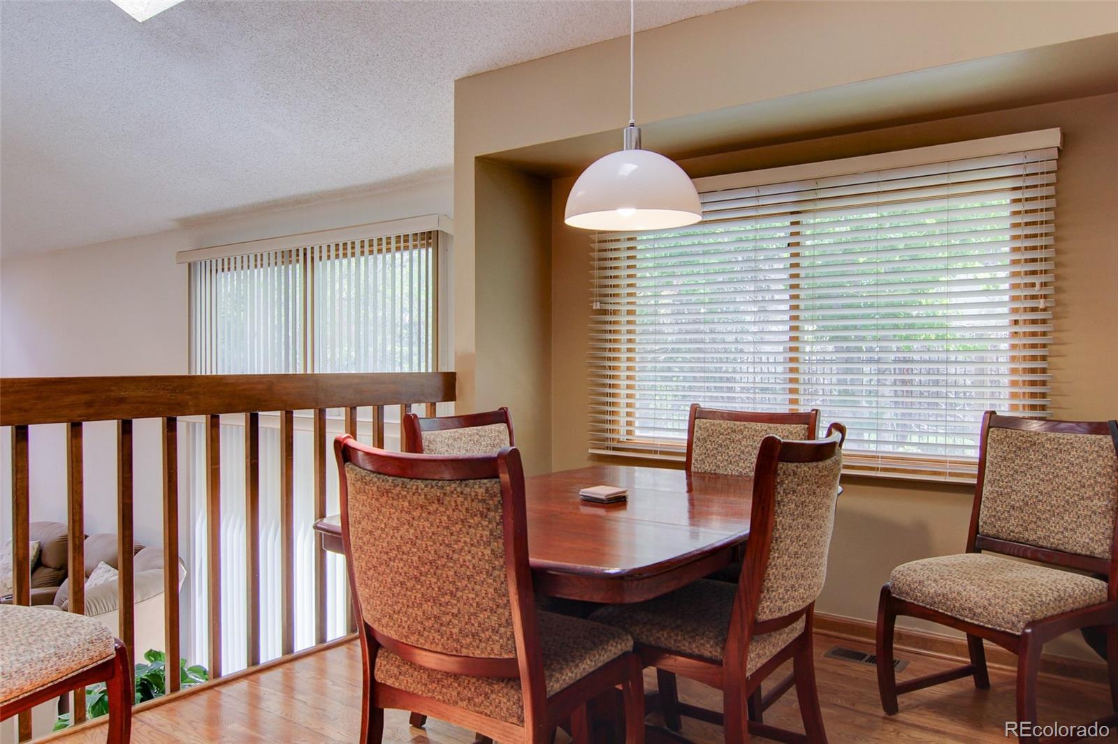 8096 Sweet Water Road Lone Tree, CO 80124 - Photo 6 of 25 a dining room with furniture and window