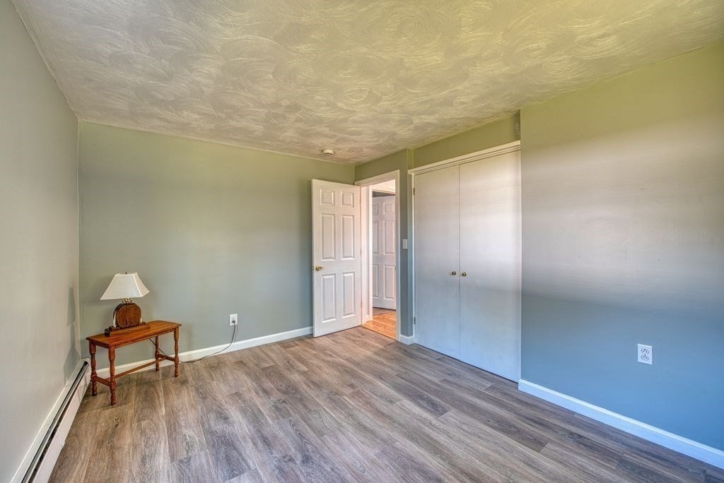 81 Errol Road Brockton, MA 02302 - Photo 14 of 31 a view of a room with wooden floor and bench