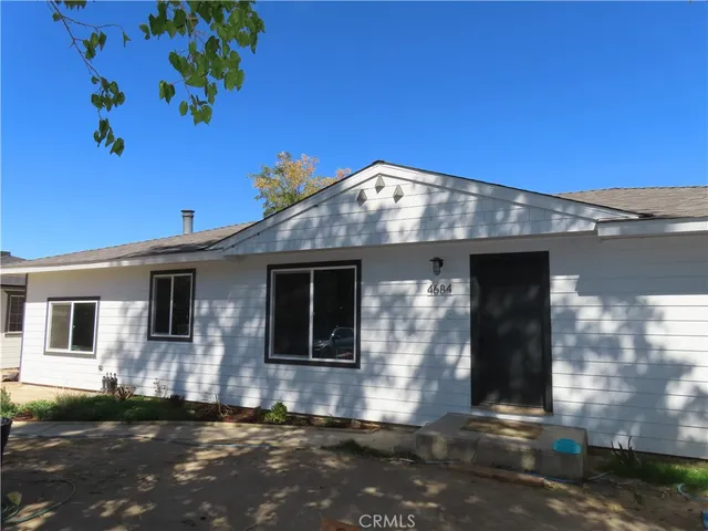 a backyard of a house with seating space