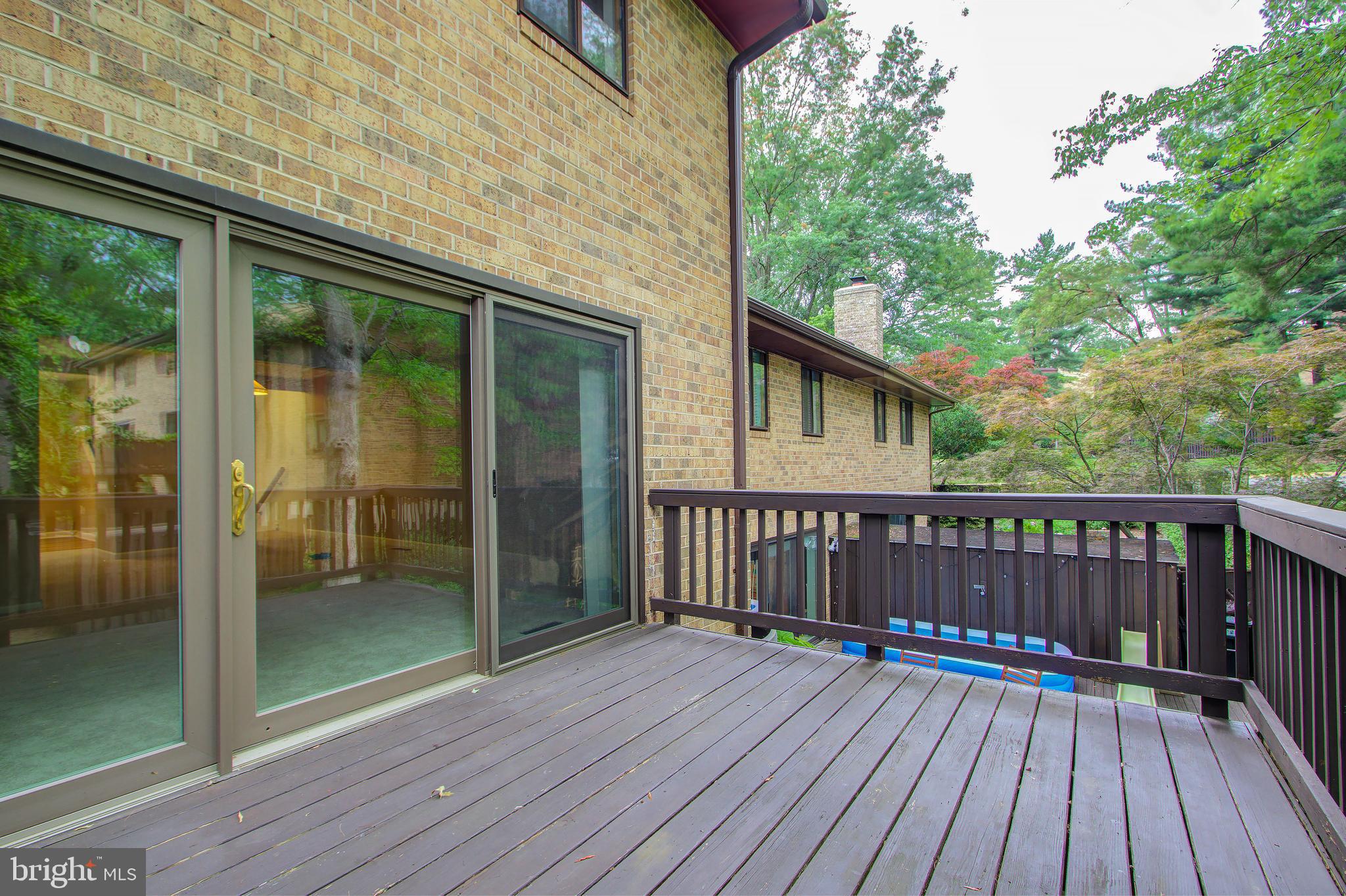 11024 Saffold Way Reston, VA 20190 - Photo 13 of 50 a view of backyard with a deck and wooden floor