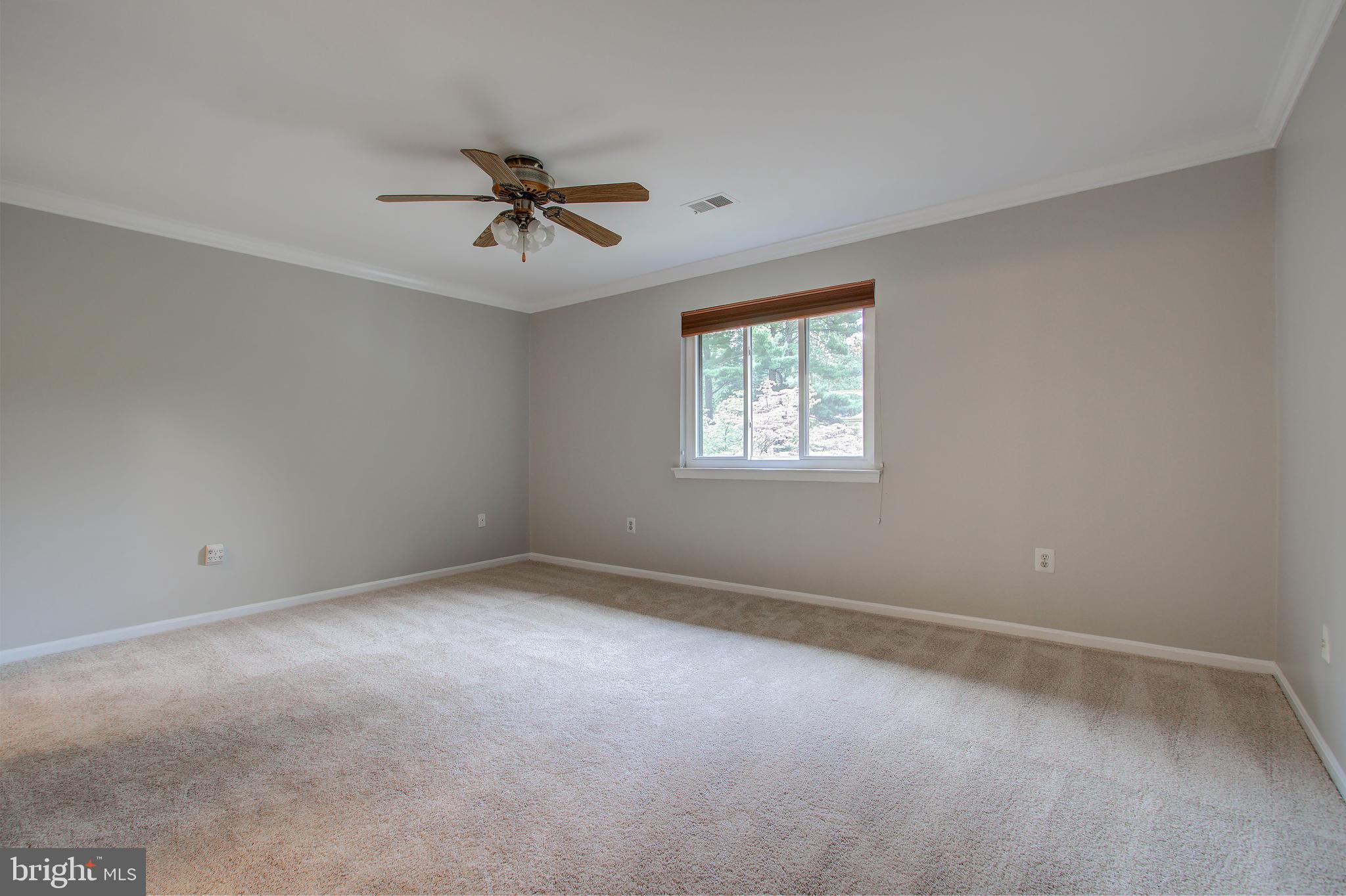 11024 Saffold Way Reston, VA 20190 - Photo 16 of 50 an empty room with windows and fan