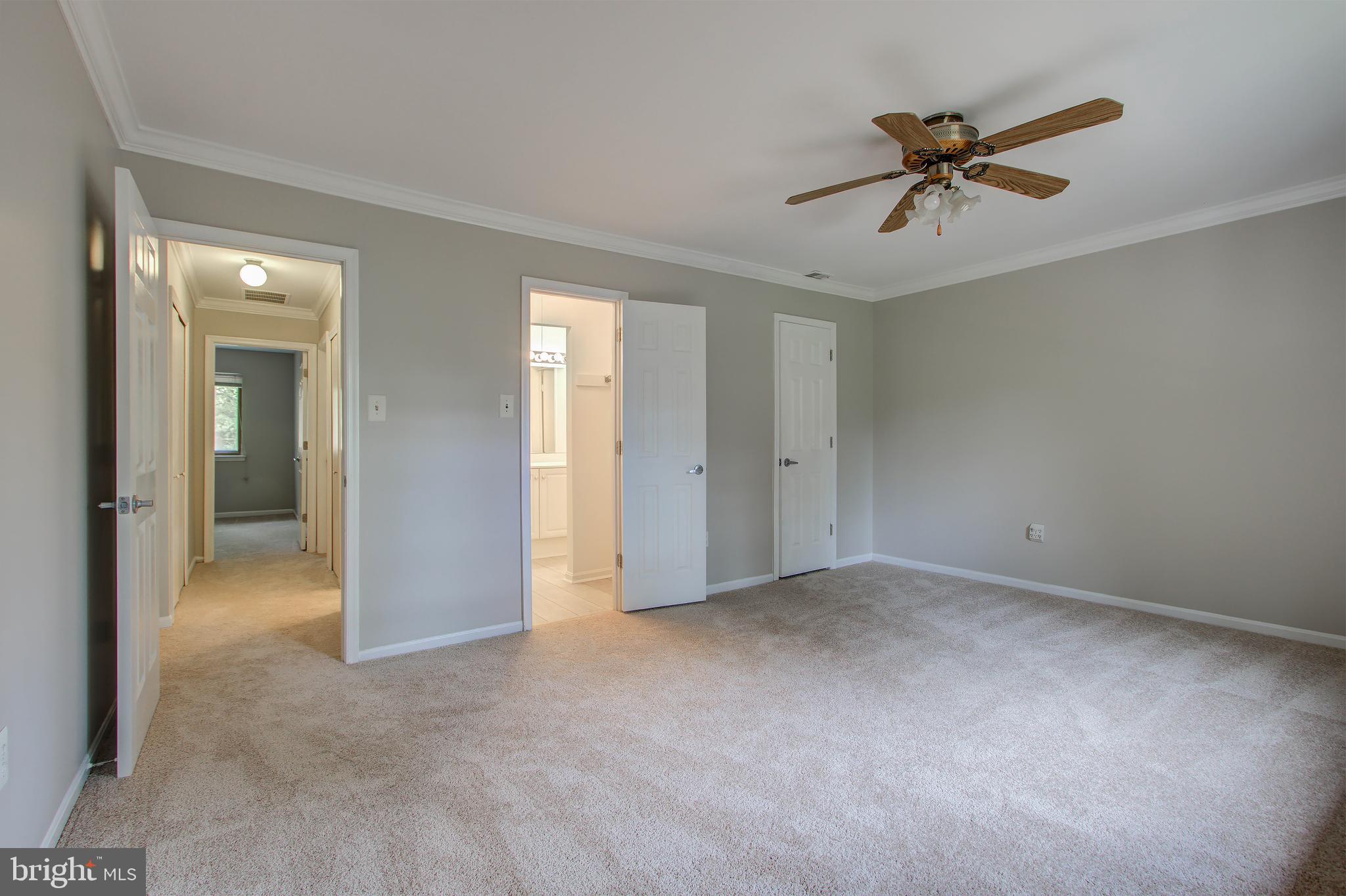 11024 Saffold Way Reston, VA 20190 - Photo 17 of 50 a view of a livingroom with a ceiling fan and entryway
