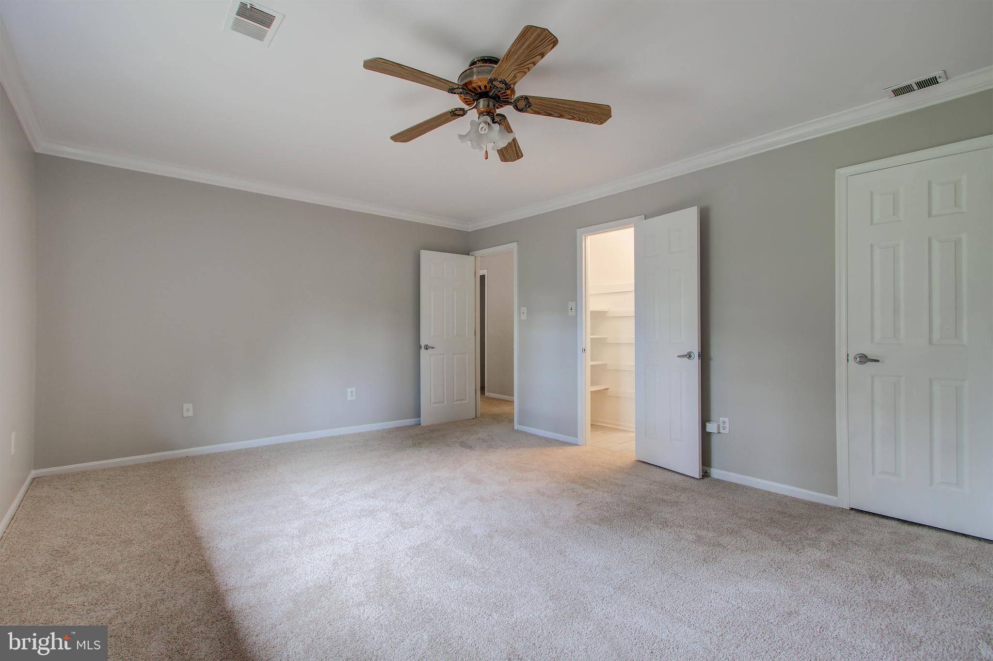 11024 Saffold Way Reston, VA 20190 - Photo 18 of 50 a view of an empty room with a ceiling fan