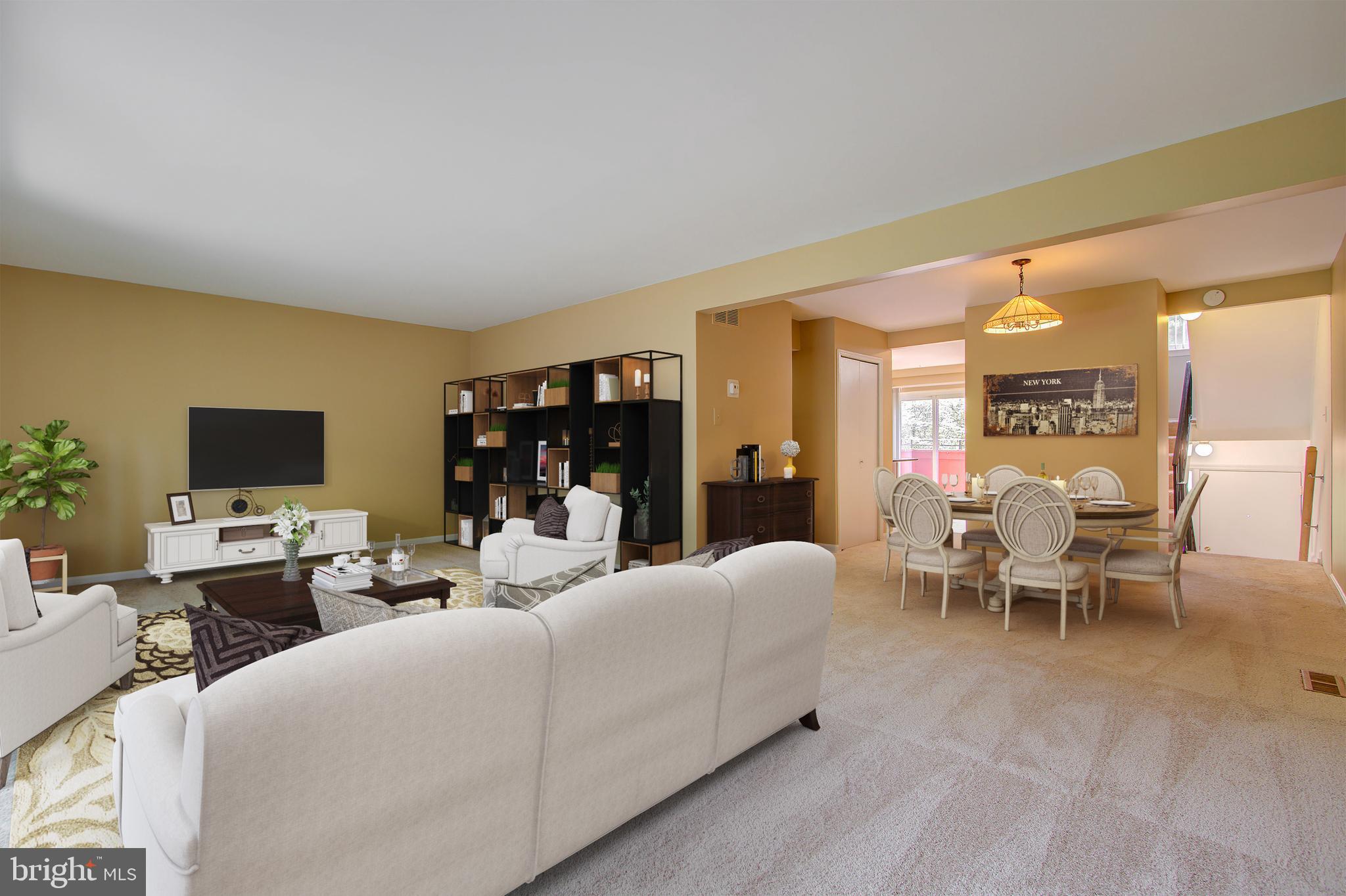 11024 Saffold Way Reston, VA 20190 - Photo 4 of 50 a living room with furniture a flat screen tv and a large window