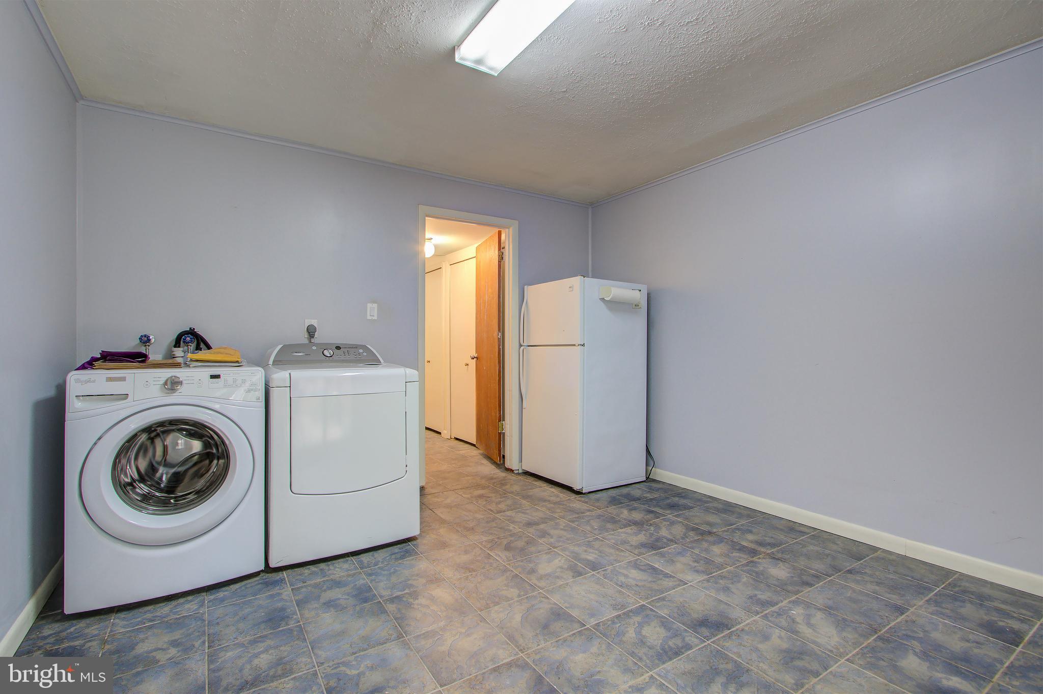 11024 Saffold Way Reston, VA 20190 - Photo 36 of 50 a utility room with dryer and washer