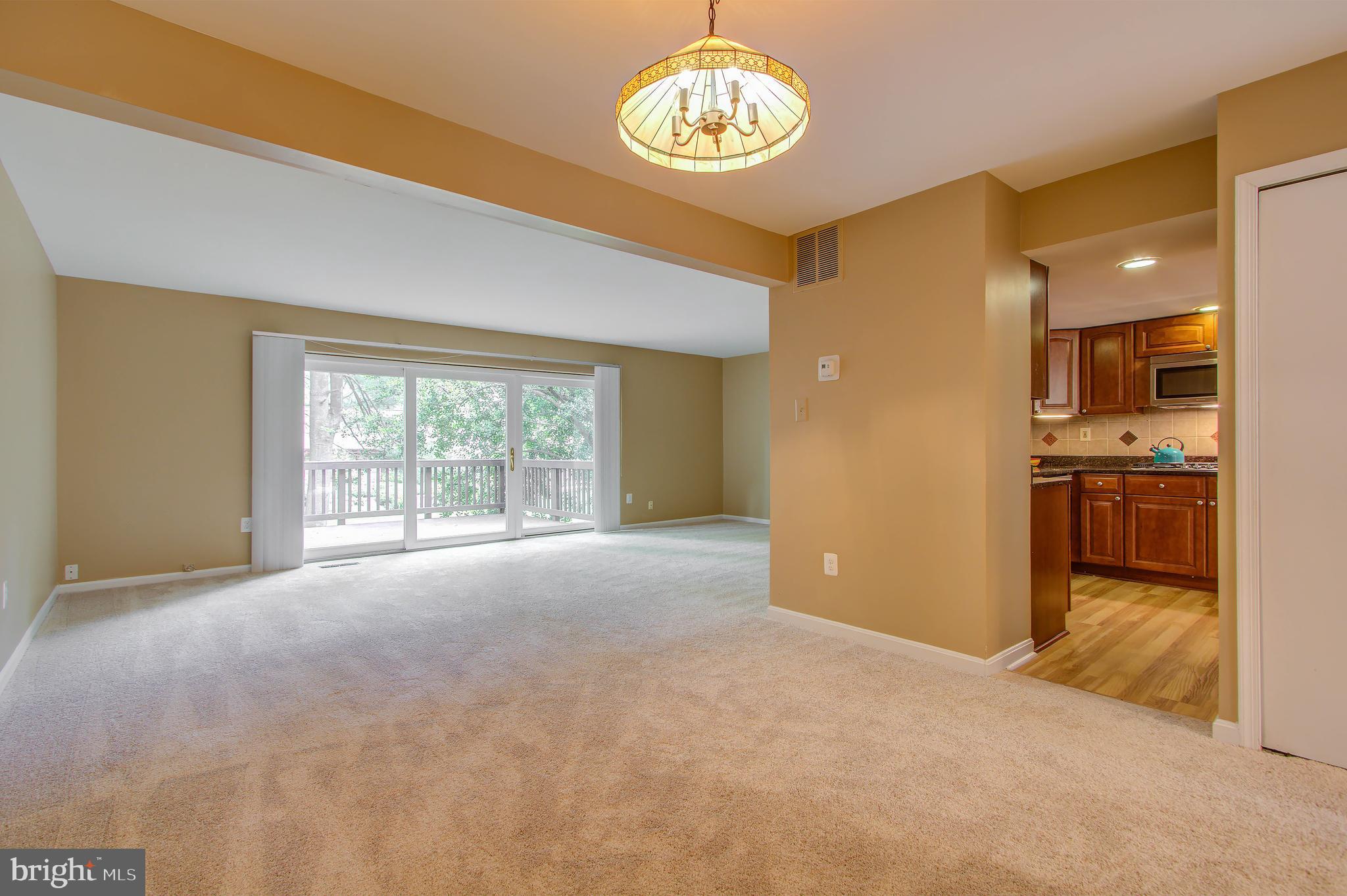 11024 Saffold Way Reston, VA 20190 - Photo 5 of 50 a view of an empty room with a window